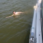 Tim swimming by the boat Tim swimming by the boat